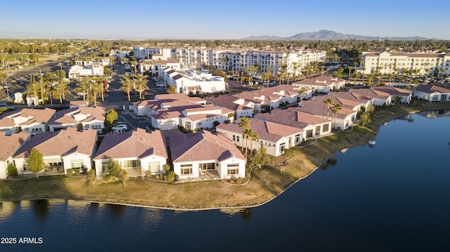 aerial view featuring a residential view and a water and mountain view