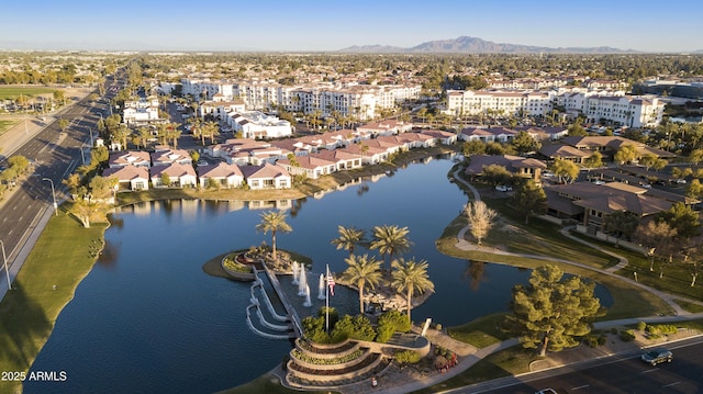 drone / aerial view with a residential view and a water and mountain view