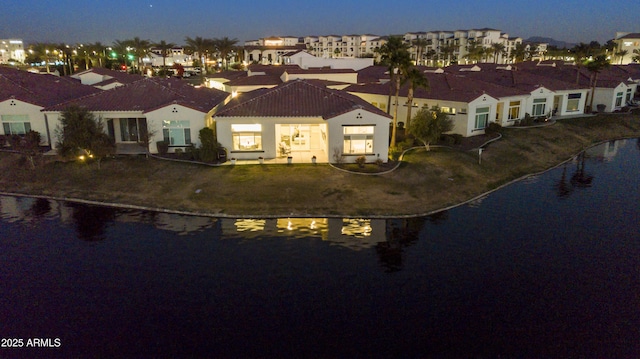 bird's eye view featuring a residential view and a water view