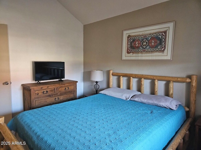 bedroom featuring lofted ceiling