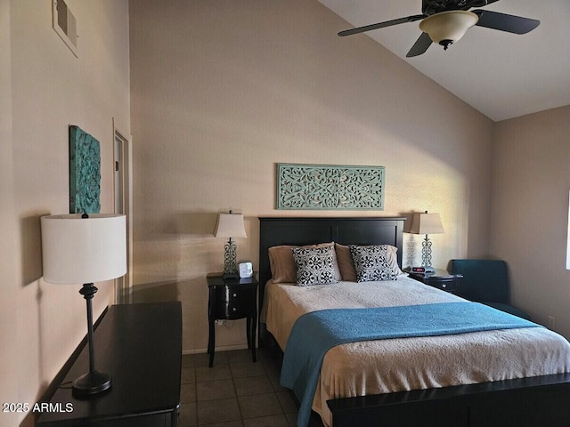 bedroom with tile patterned flooring, vaulted ceiling, baseboards, and a ceiling fan