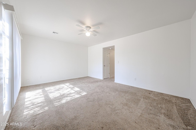 carpeted empty room with ceiling fan