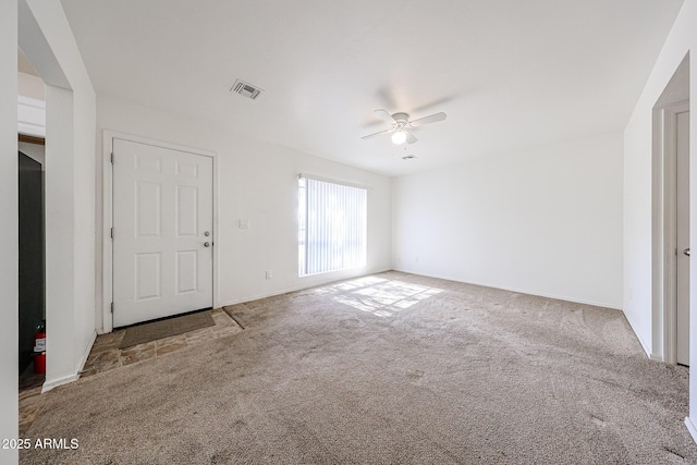 interior space with ceiling fan