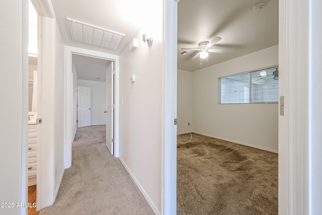 corridor featuring light carpet