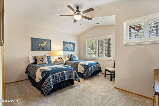 carpeted bedroom with multiple windows, vaulted ceiling, and ceiling fan