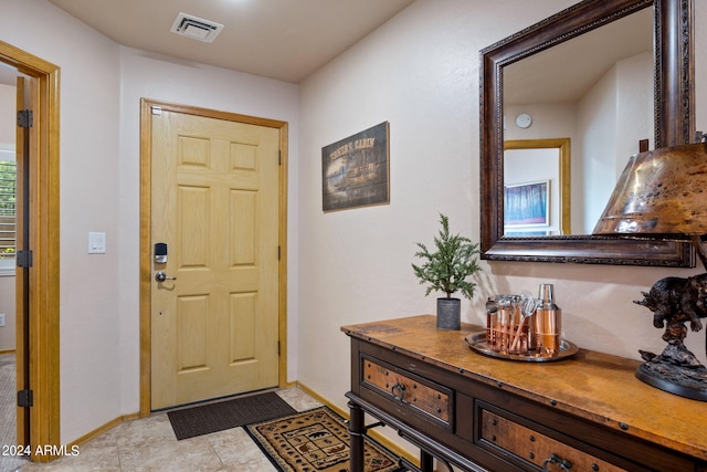 foyer entrance featuring light tile patterned floors