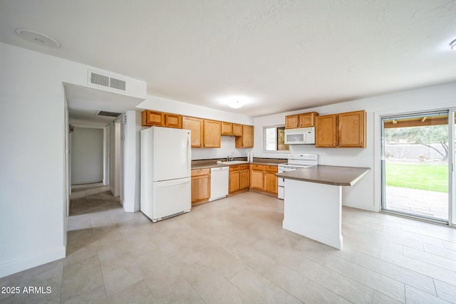 kitchen featuring sink and white appliances