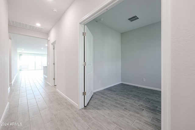 corridor featuring light hardwood / wood-style flooring