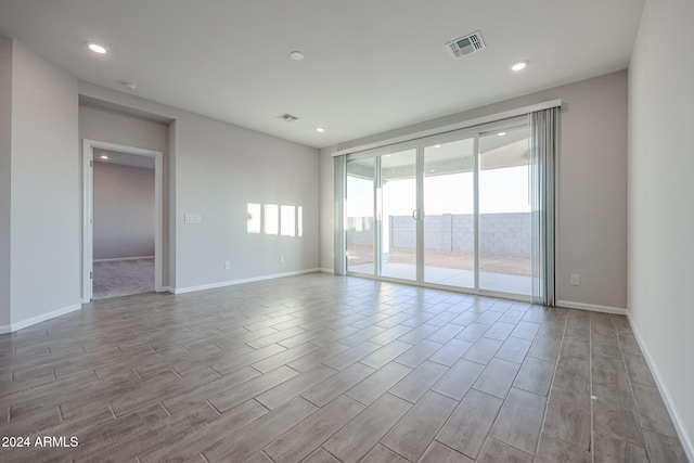 spare room with light wood-type flooring