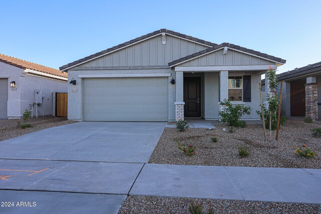 view of front of house with a porch and a garage