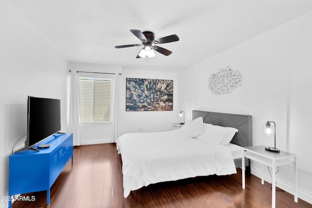 7350 N Via Paseo Del Sur Unit O202, Scottsdale, AZ 85258 - bedroom with a ceiling fan, baseboards, and wood finished floors