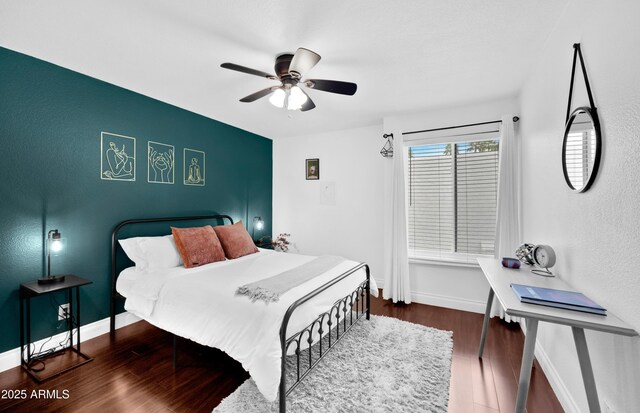7350 N Via Paseo Del Sur Unit O202, Scottsdale, AZ 85258 - bedroom featuring baseboards, ceiling fan, and wood finished floors