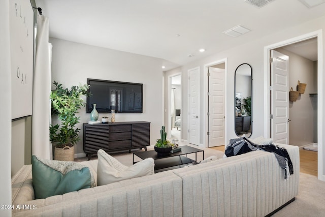 living room featuring light colored carpet