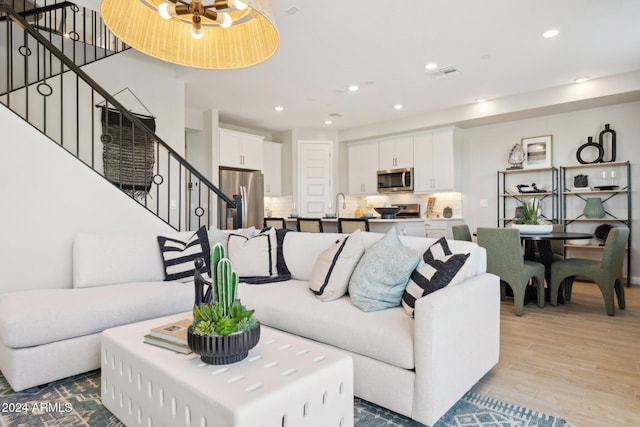 living room with light hardwood / wood-style floors