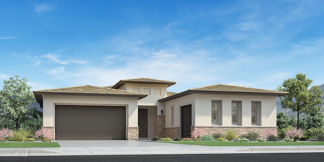 prairie-style home with a garage