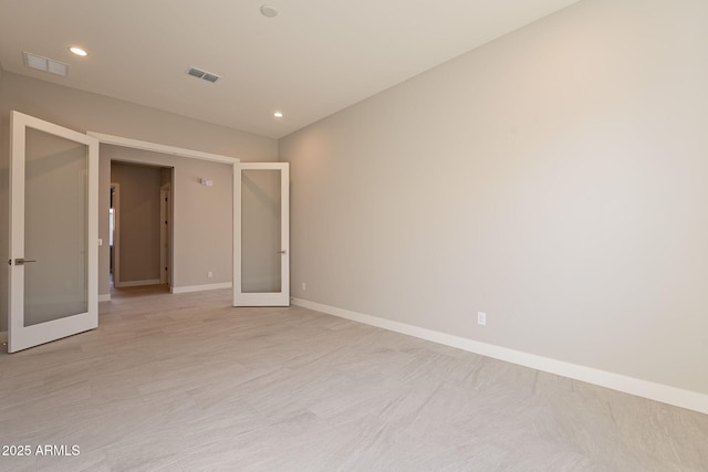 empty room featuring french doors