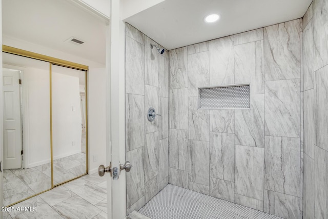 3204 N Jay St, Chandler, AZ 85225 - bathroom with a tile shower, marble finish flooring, and recessed lighting