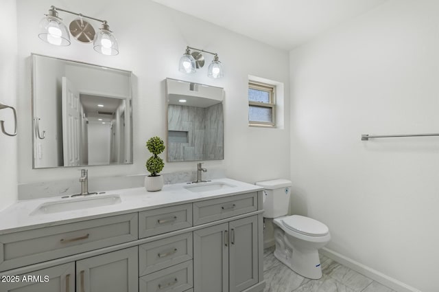 3204 N Jay St, Chandler, AZ 85225 - bathroom featuring double vanity and marble finish flooring