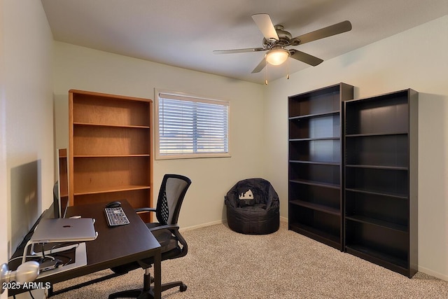 carpeted home office with ceiling fan