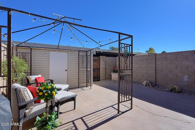 view of patio featuring an outdoor structure