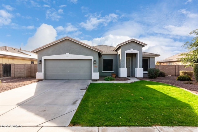 view of front of home with a front lawn and a garage