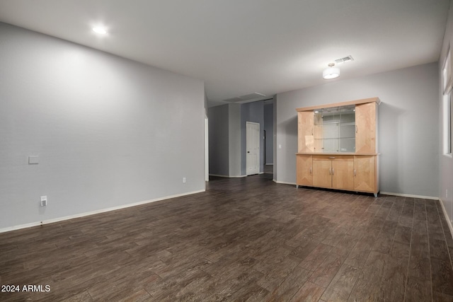 spare room featuring dark hardwood / wood-style floors