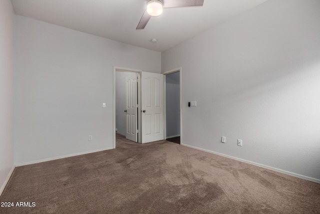 unfurnished bedroom featuring ceiling fan and carpet flooring