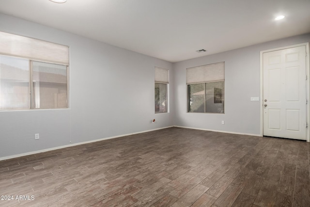 empty room with dark wood-type flooring