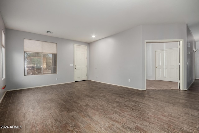 empty room featuring dark wood-type flooring