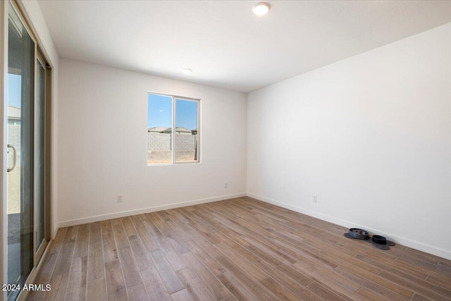 spare room featuring light hardwood / wood-style floors