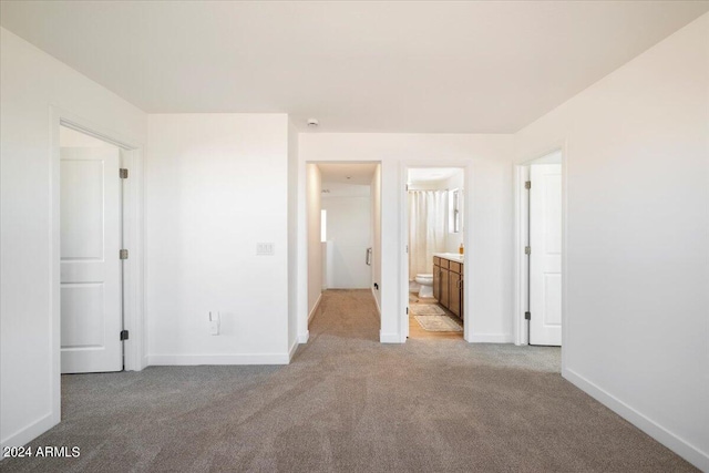 empty room featuring light colored carpet