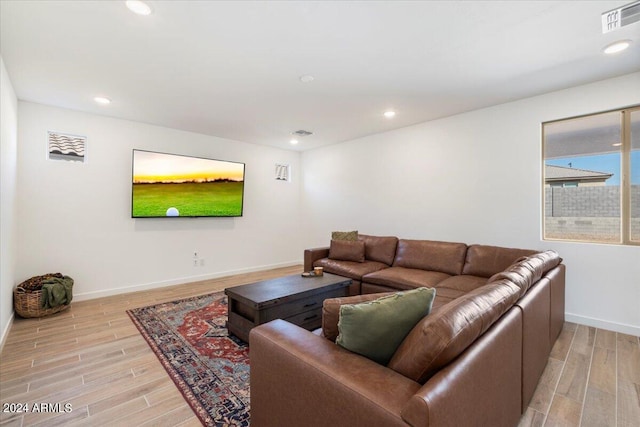 living room with light hardwood / wood-style flooring