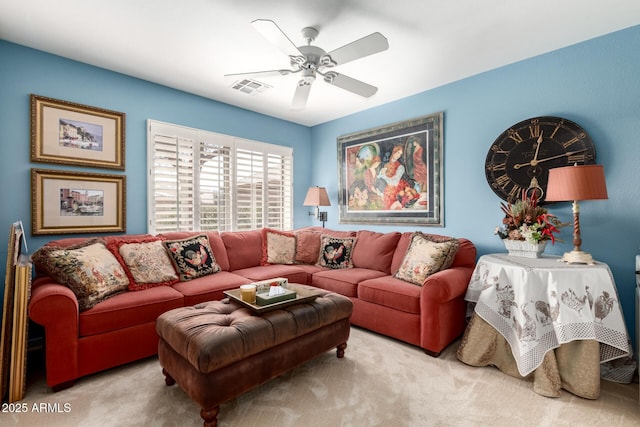 living room with light colored carpet, visible vents, and ceiling fan