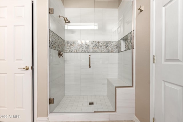 bathroom with a shower stall