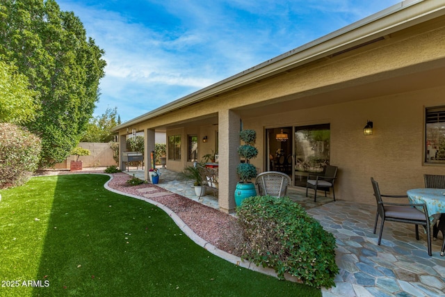 exterior space featuring a patio and fence