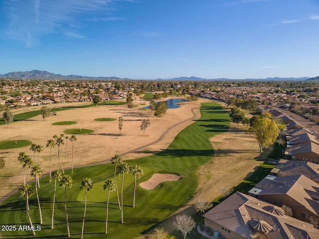 aerial view featuring a residential view, a mountain view, and golf course view