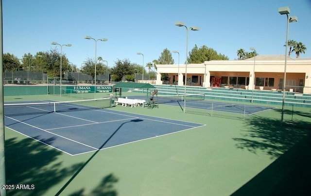 view of sport court with fence