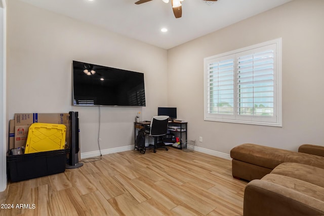 interior space with ceiling fan and light hardwood / wood-style floors