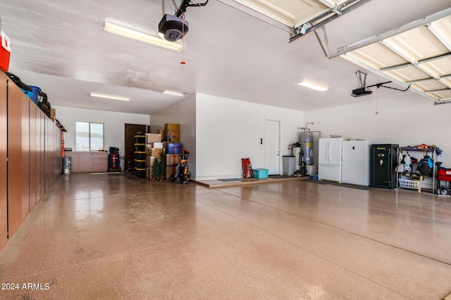 garage featuring a garage door opener, white fridge, and water heater