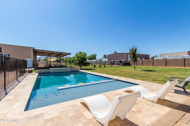 view of swimming pool with a patio and a yard