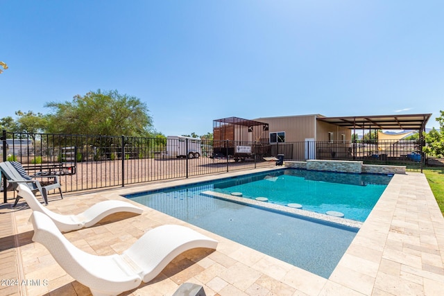 view of swimming pool featuring a patio area