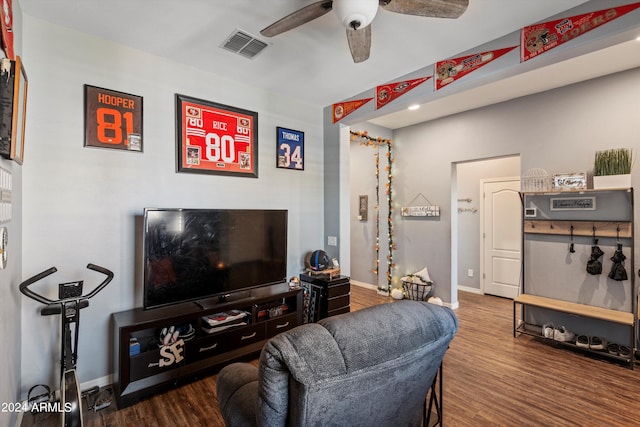 living room featuring ceiling fan and hardwood / wood-style flooring