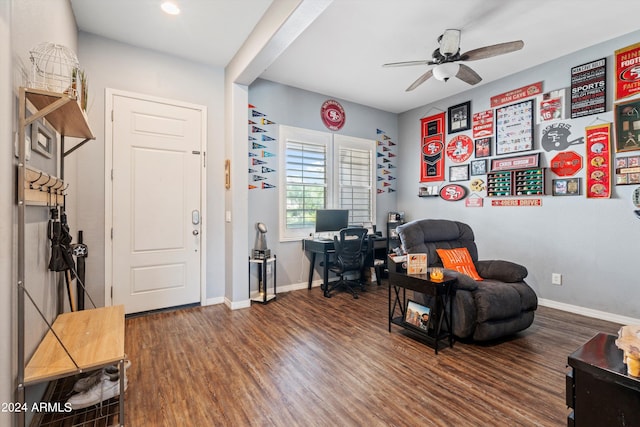 living area with wood-type flooring and ceiling fan