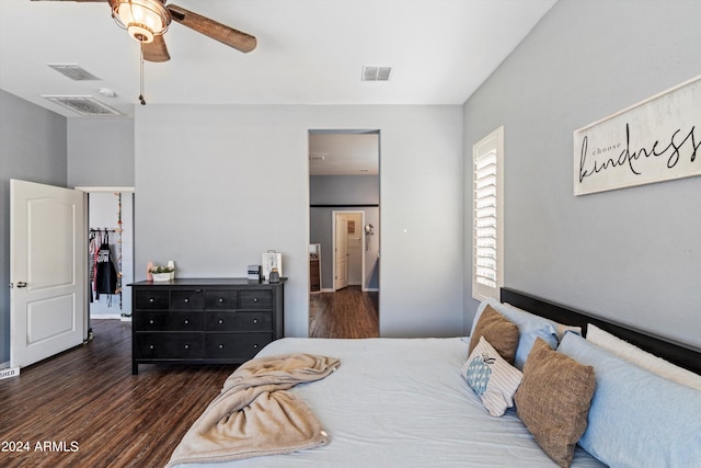 bedroom with ceiling fan and dark hardwood / wood-style floors