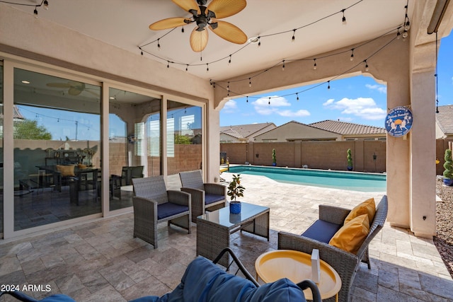 view of patio featuring an outdoor hangout area and a fenced in pool