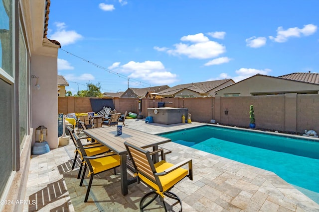 view of swimming pool with a patio area