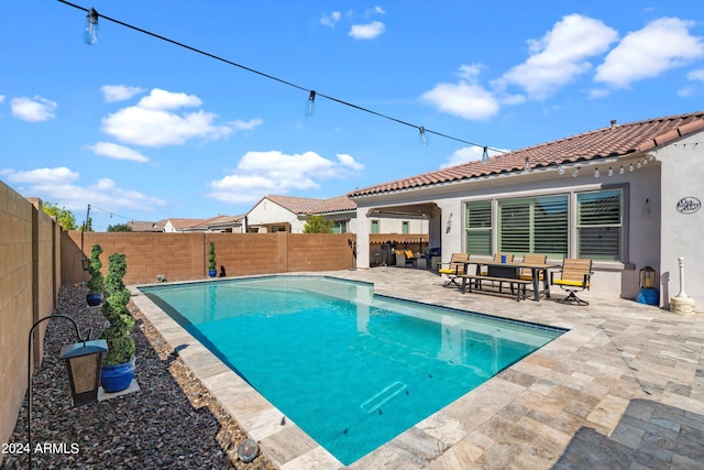 view of pool featuring a patio area