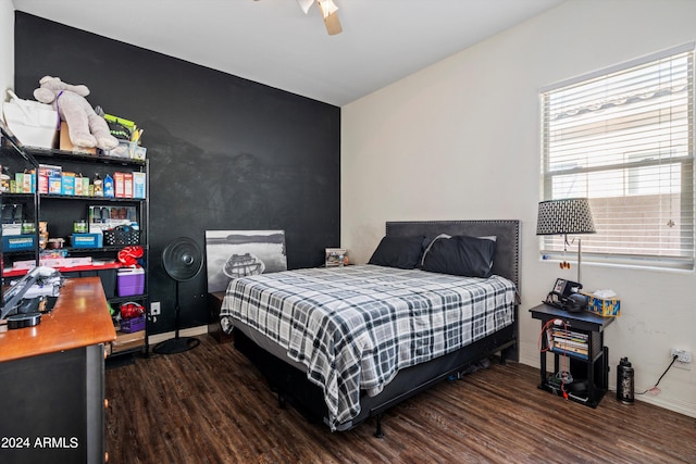 bedroom featuring ceiling fan and dark hardwood / wood-style flooring