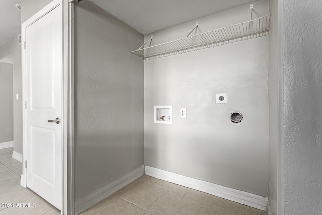 laundry room with hookup for a washing machine, light tile patterned flooring, and hookup for an electric dryer