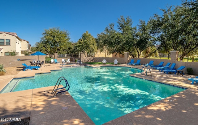 view of swimming pool featuring a patio